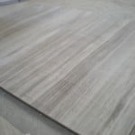 Acacia Grey Marble with wood veining.