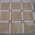 Creating Contrast with Snow White Marble Tile with Contrasting Accents.