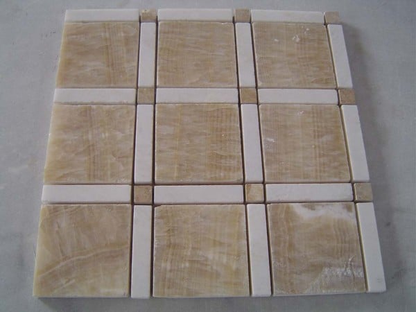 Creating Contrast with Snow White Marble Tile with Contrasting Accents.