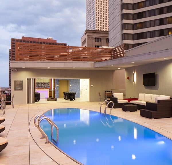 Outdoor Living Rooftop Pool Deck on Canal Street Built with Buzon Pedestals and Porcelain Pavers