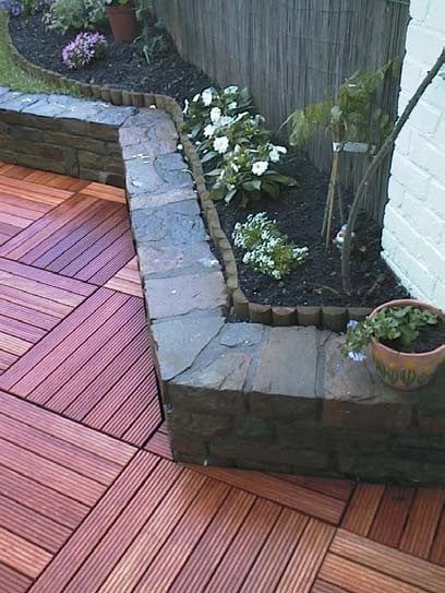 Stone Wall with Ipe Deck Tiles over Buzon Pedestals - HDG Building Materials