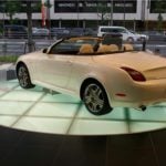 Buzon Translucent Pedestals with Illuminated Glass Pavers in Vehicle Showroom