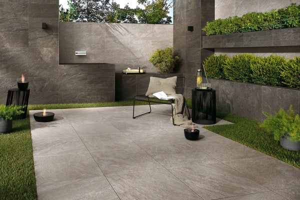 Outdoor patio and wall application using quartzite porcelain pavers from HDG Building Materials.