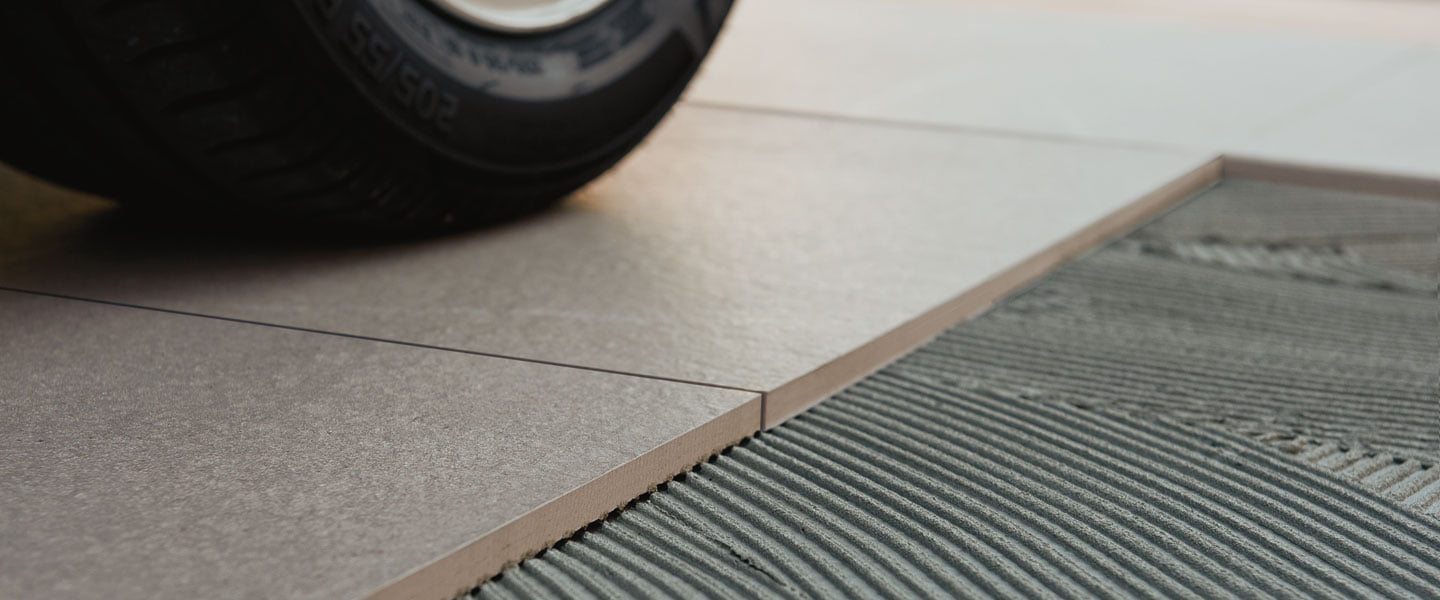 Porcelain Paver Installation Over Concrete with Thinset for Driveway Applications.