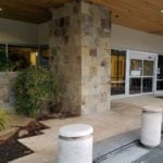 Stone cladding pavers bollards at Swedish Hospital Entrance - HDG Building Materials