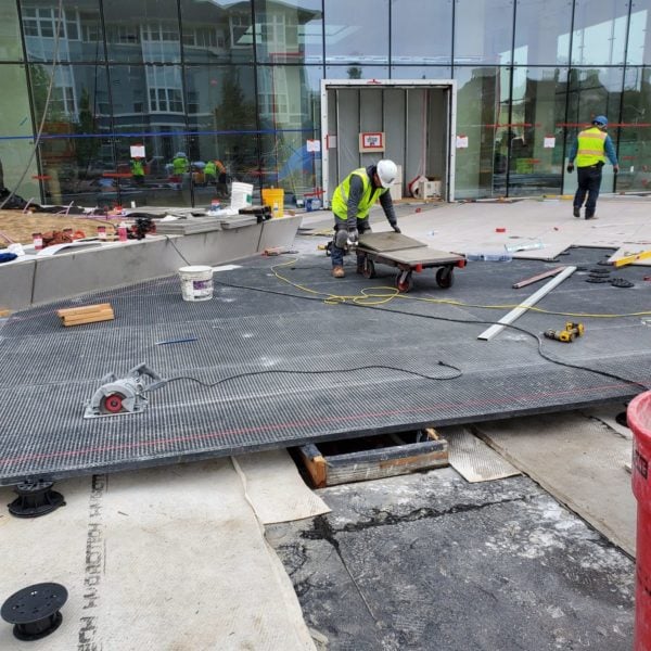 HDG Grating Panel Project With Sloped Design Using Buzon Pedestals and Porcelain Pavers