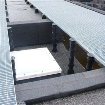 HDG Grating Panels and Buzon Pedestals Span Uneven Floors and Trenches