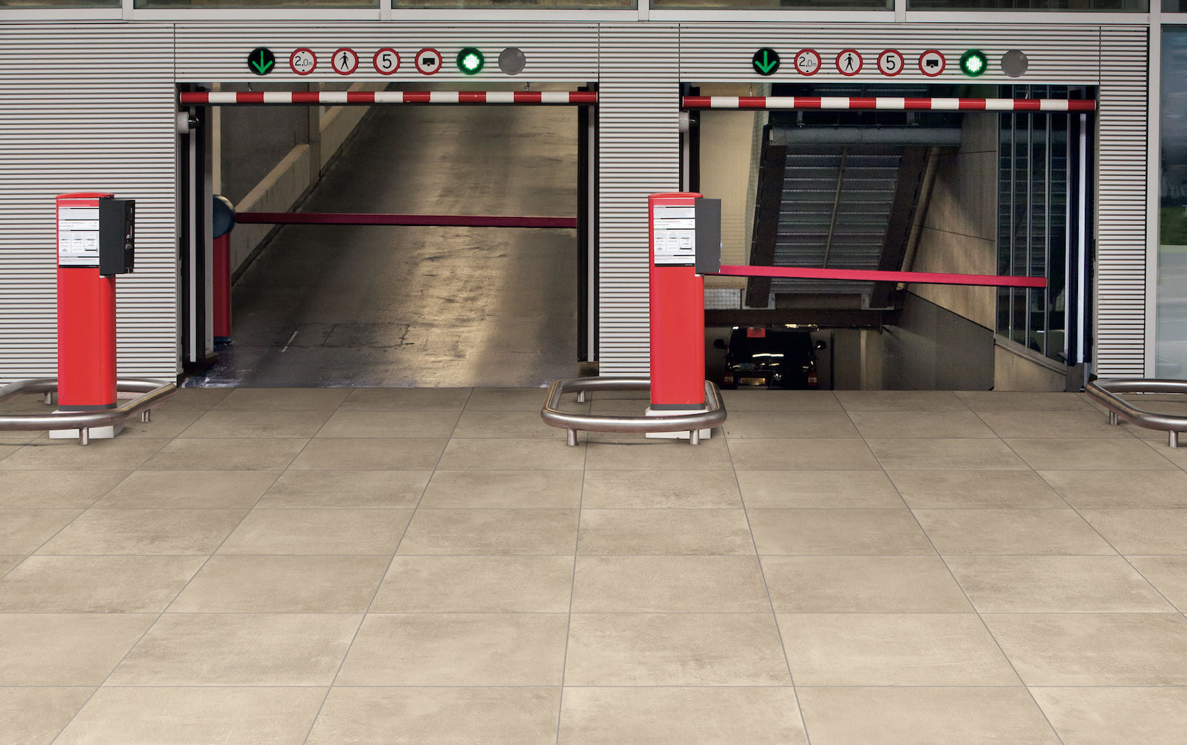 3cm porcelain driveway pavers supporting vehicle traffic in a public garage entrance.
