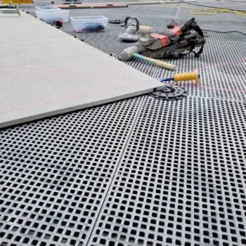 Porcelain Pavers Set on Buzon Pedestals Over HDG Grating Panels