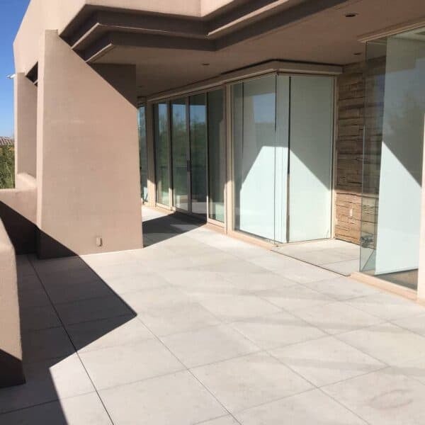 Patio Makeover uses HDG Porcelain Pavers Installed Over Buzon Pedestals