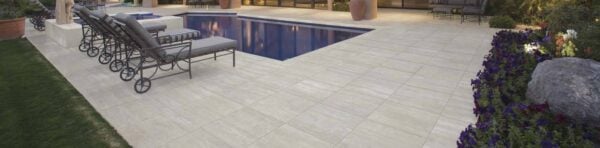 Trevino Tan Travertine Porcelain Pavers in outdoor swimming pool surround