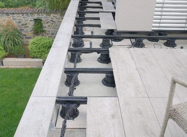 Buzon Pedestals with U-BRS-Aluminum Joist System and Porcelain Paver Planks.