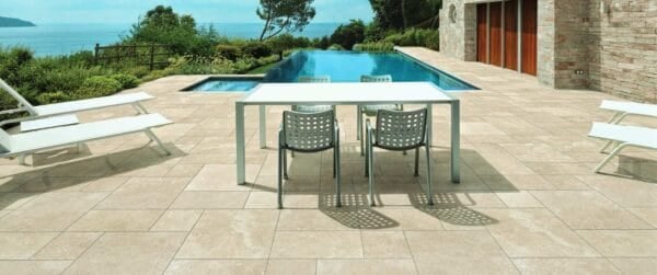 Cream Travertine Finish Porcelain Pavers in Pool Surround