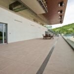 Stadium terrace with granite-look porcelain paver, 60x60 cm (24x24 in)