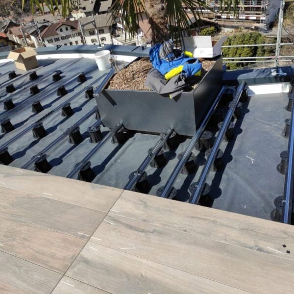 Wood Look Porcelain paver planks on E-BRS Easy Rail System with Perimeter Containment.