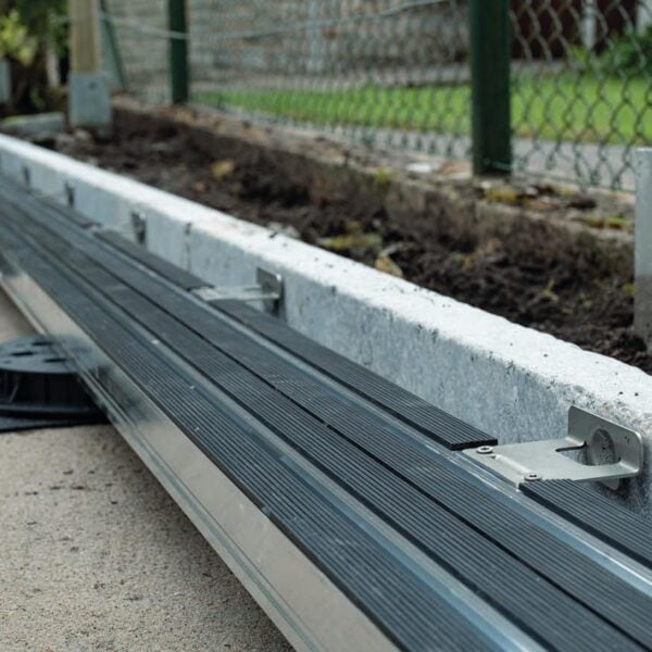 Edge Stop accessory where E-BRS Easy Rail system meets granite curbstone.