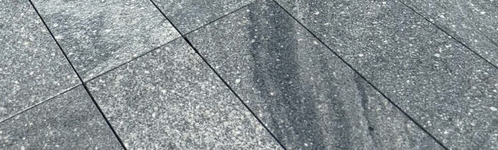 Grey granite stone with veins on Boston South Station pool deck and terrace