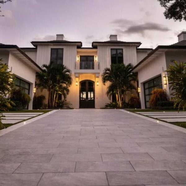 Grand approach and entrance to villa with parking lot porcelain pavers.