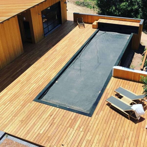 Overhead view of a pool house and compact swimming pool surrounded by Black Locust decking.