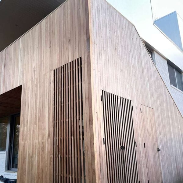 Modern building clad in Black Locust 1 × 4 Nickel Gap wood siding.